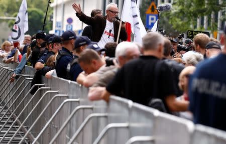 Pawel Kasprzak, one o the leader of Citizens of Poland speaks during an anti-government protest in support of free courts outside the Parliament building in Warsaw July 18, 2018. REUTERS/Kacper Pempel