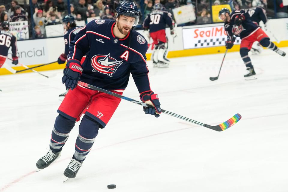 Jan 15, 2024; Columbus, Ohio, USA; Columbus Blue Jackets center Sean Kuraly (7) warms up with rainbow pride tape on his stick on Hockey Is For Everyone day at the NHL hockey game against the Vancouver Canucks at Nationwide Arena.