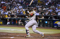 San Diego Padres' Jorge Alfaro watches a three-run double against the Arizona Diamondbacks during the fifth inning of a baseball game Tuesday, June 28, 2022, in Phoenix. (AP Photo/Ross D. Franklin)