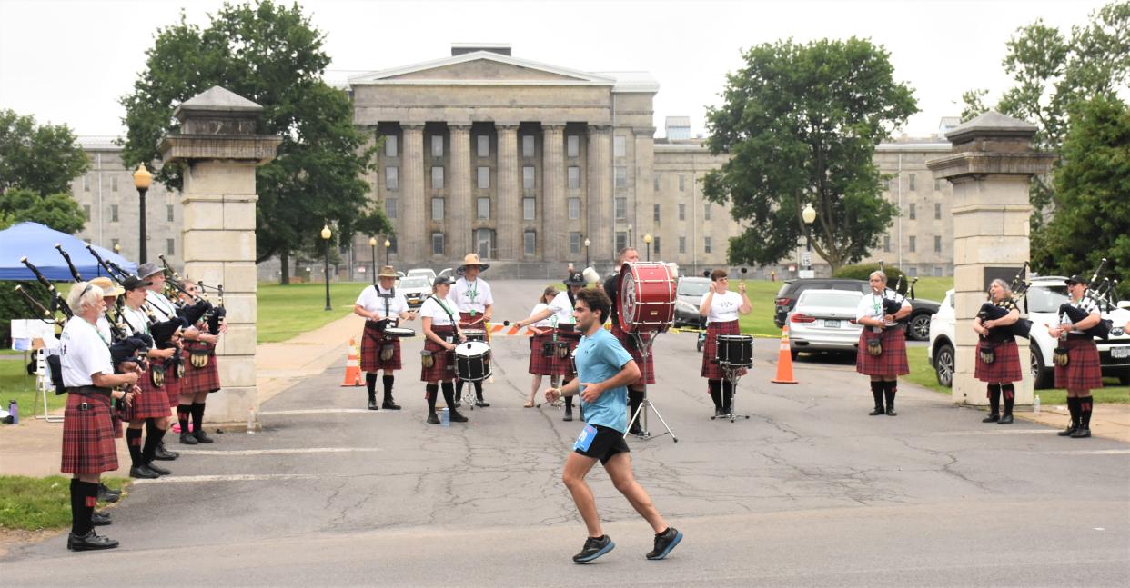 Bagpipers entertained runners and Boilermaker Road Race spectators from their position at the Whitesboro Street entrance to the Mohawk Valley Psychiatric Center in Utica, New York, Sunday, July  9, 2023.