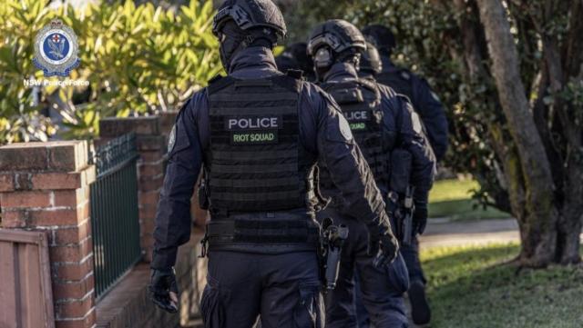 Police prepare to search the jeweller&#x002019;s home. Picture: NSW Police