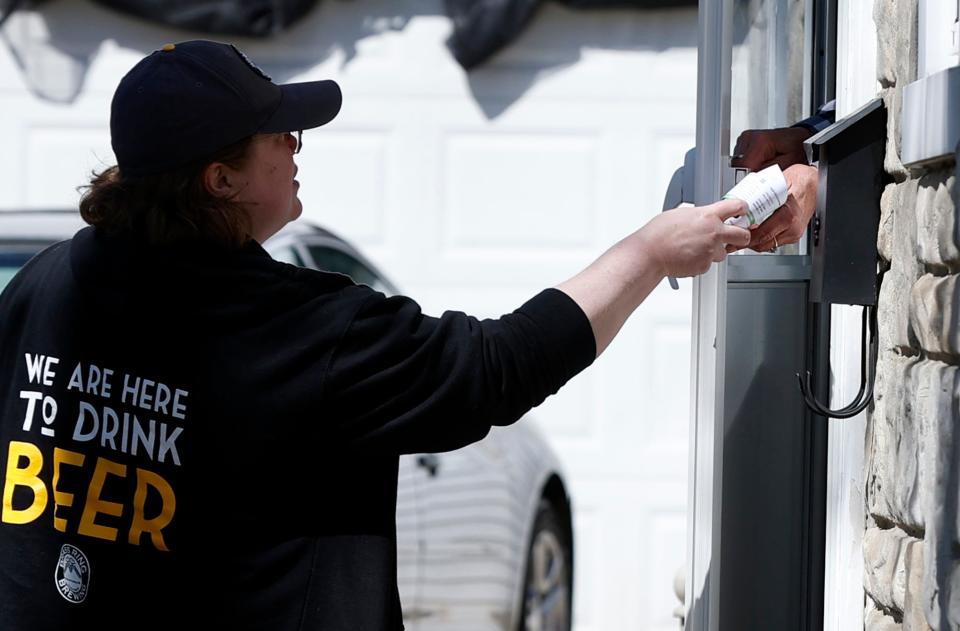 Rae Westerhof walks around in a Grand Rapids neighborhood canvassing for State Rep. John Fitzgerald of House District 83 on Friday, April 19, 2024.