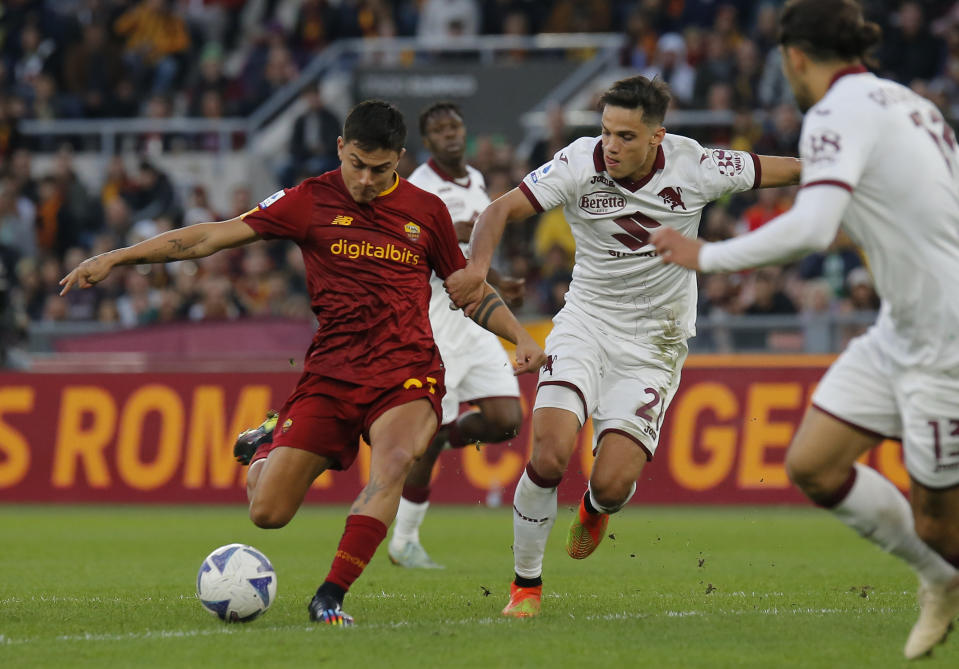 ROME, ITALY - NOVEMBER 13: Paulo Dybala of AS Roma, Samuele Ricci of Torino FC battle for the ball during the Serie A match between AS Roma and Torino FC at Stadio Olimpico on November 13, 2022 in Rome, Italy. (Photo by Carlo Hermann/DeFodi Images via Getty Images)