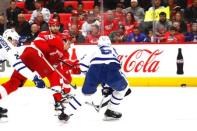 Dec 15, 2017; Detroit, MI, USA; Detroit Red Wings defenseman Danny DeKeyser (65) scores in the second period against Toronto Maple Leafs defenseman Andreas Borgman (55) at Little Caesars Arena. Mandatory Credit: Rick Osentoski-USA TODAY Sports