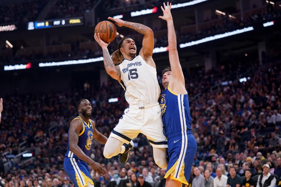 May 13, 2022; San Francisco, California, USA; Memphis Grizzlies forward Brandon Clarke (15) is fouled by Golden State Warriors forward Nemanja Bjelica (8) in the second quarter during game six of the second round for the 2022 NBA playoffs at Chase Center. Mandatory Credit: Cary Edmondson-USA TODAY Sports