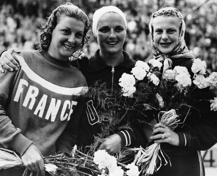 L-R: Madeleine Moreau of France (silver medallist, 139.34 points); Patricia McCormick of USA.
