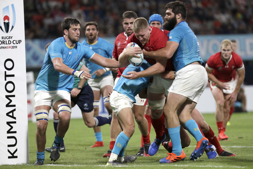 Wales' Bradley Davies runs at the defence during the Rugby World Cup Pool D game at Kumamoto Stadium between Wales and Uruguay in Kumamoto, Japan, Sunday, Oct. 13, 2019. (AP Photo/Aaron Favila)