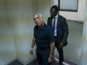 This image released by Amazon shows Titus Welliver, left, and Jamie Hector in a scene from the series "Bosch," based on the book series by Michael Connelly. (Saeed Adyani/Amazon via AP)