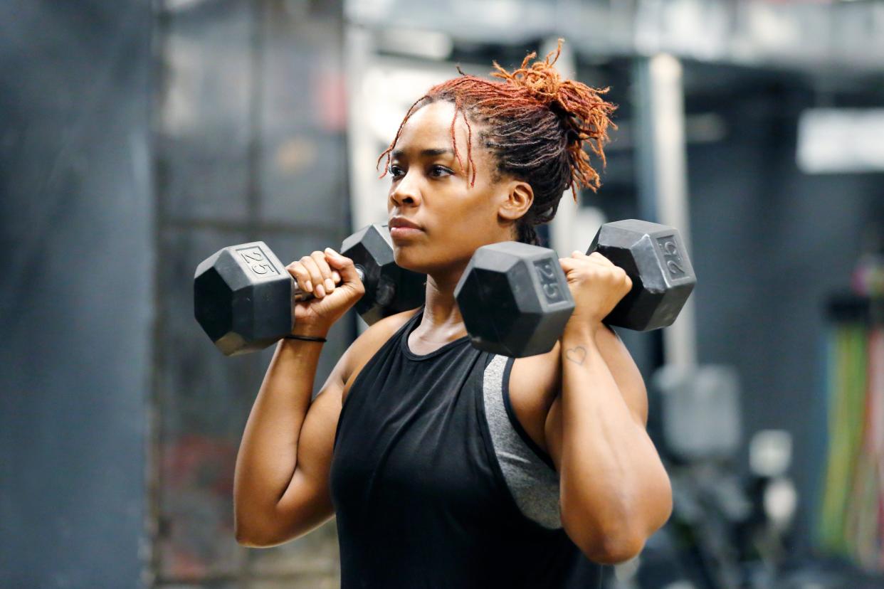 Woman lifting weights.