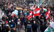 Thousands of people march to protest against restrictions on public life to curb the coronavirus pandemic