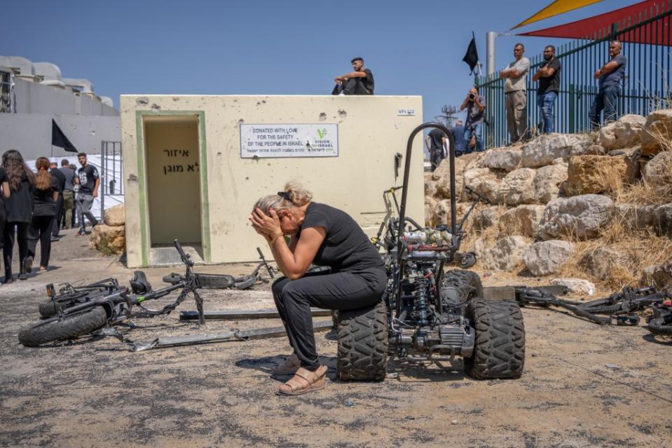 29 July 2024, Israel, Majdal Shams: Families and relatives mourn at the site of a rocket attack in the Druze town of Majd al-Shams in the Israeli-controlled Golan Heights. Photo: Ilia Yefimovich/dpa (Photo by Ilia Yefimovich/picture alliance via Getty Images)