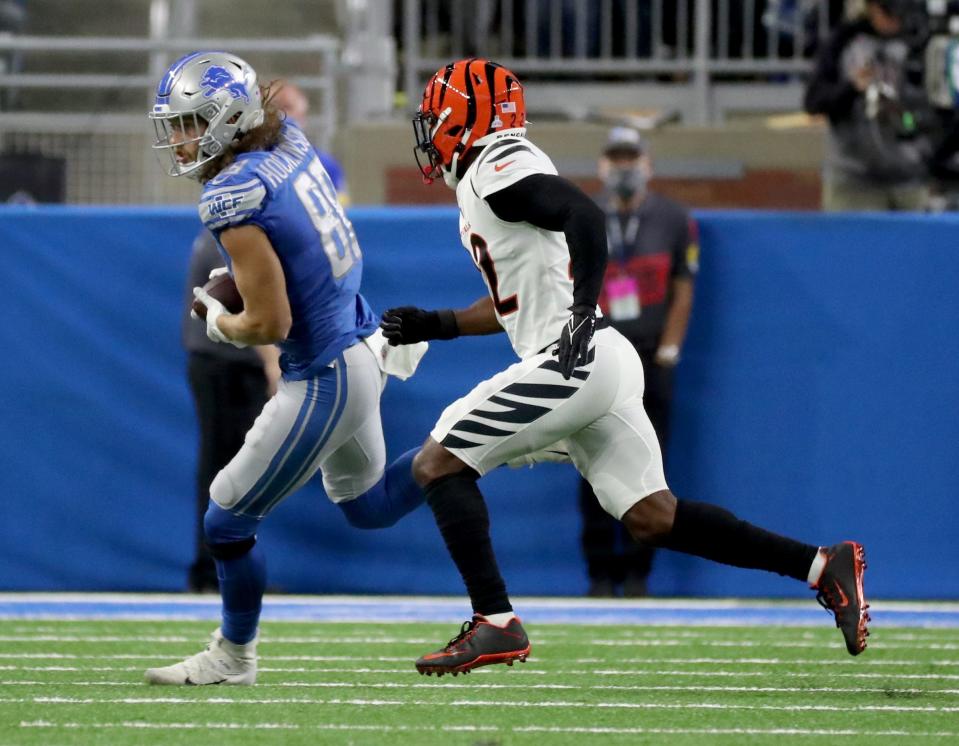 Bengals cornerback Chidobe Awuzie chases after Lions tight end T.J. Hockenson during a game Oct. 17, 2021.