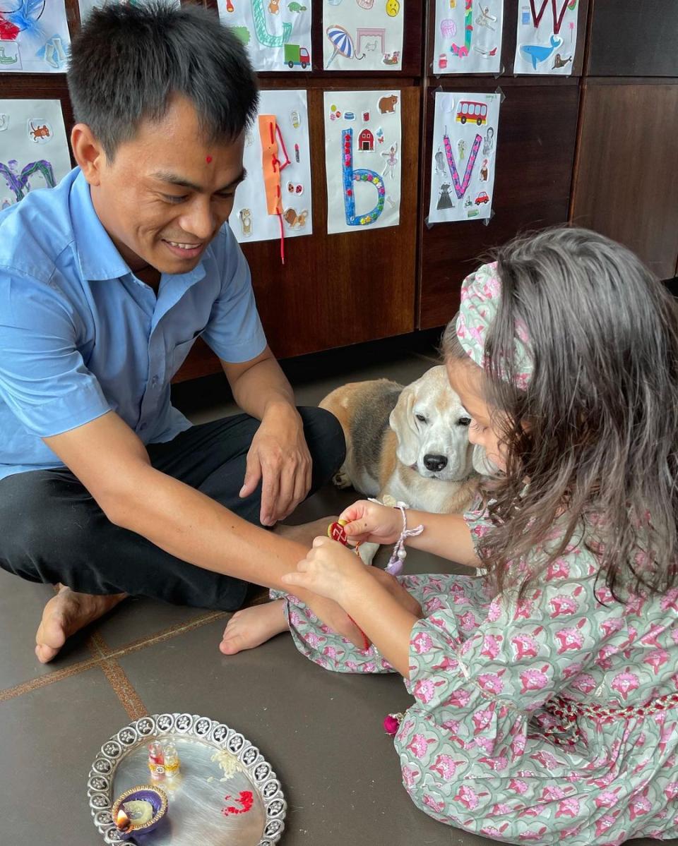 Inaaya tying a rakhi