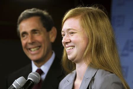 Abigail Fisher (R), a white suburban Houston student who asserted she was wrongly rejected by the University of Texas at Austin while minority students with similar grades and test scores were admitted thanks to the admissions policy, and Edward Blum (L), director of the Project on Fair Representation, smile at a news conference in Washington in this June 24, 2013 file photo. REUTERS/Jonathan Ernst/Files
