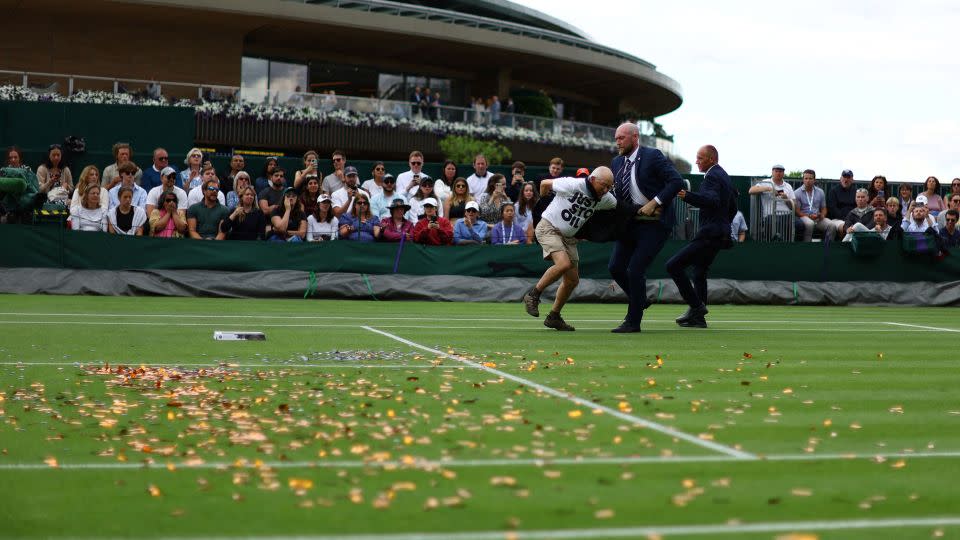 A Just Stop Oil protester disrupts a match at July's Wimbledon Championships. Sunak's ministers have been attempting to link the group to the Labour Party, which is on course to win the next election. - Hannah Mckay/Reuters