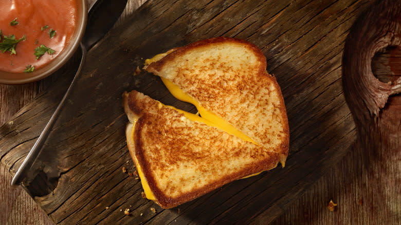 Cooked grilled cheese on wood