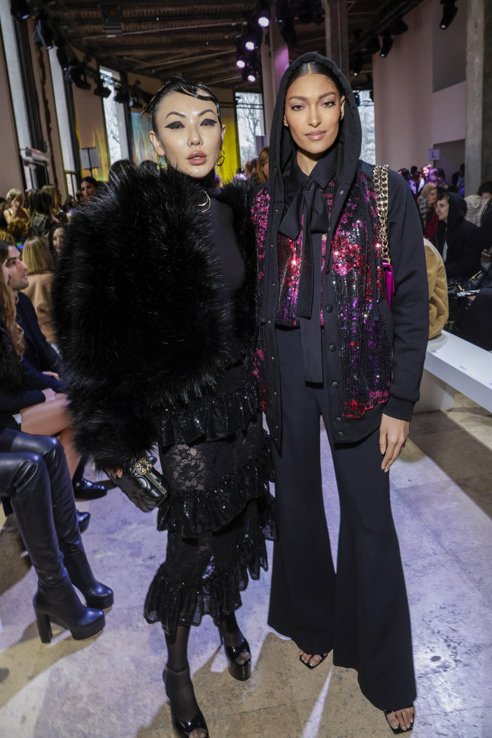 Jessica Wang, left, and Pritika Swarup pose for photographers at the Elie Saab Fall/Winter 2023-2024 ready-to-wear collection presented Saturday, March 4, 2023 in Paris. (Vianney Le Caer/Invision/AP)