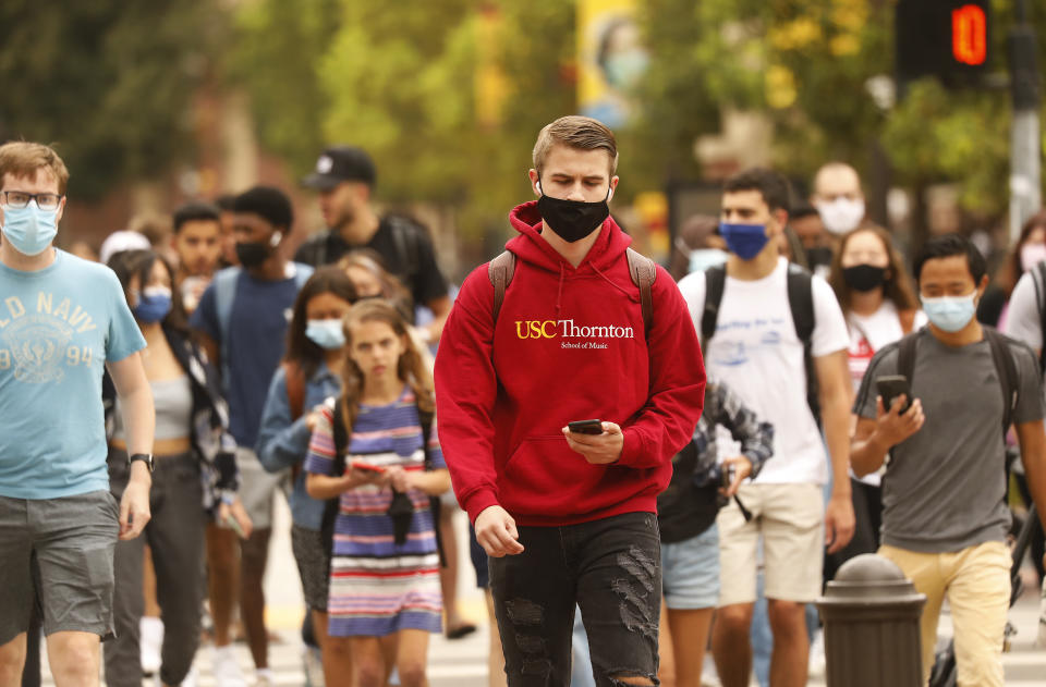 USC students, faculty and visitors use their phones to display their 