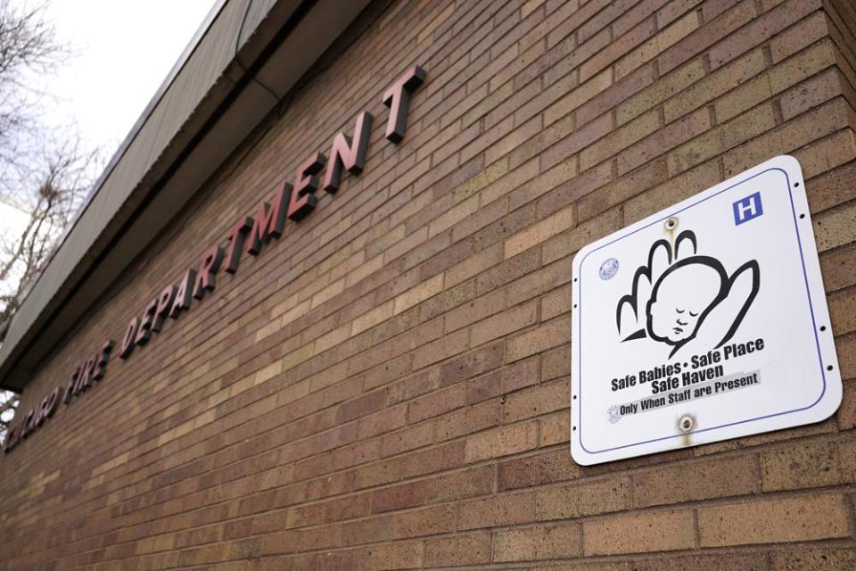 Safe Haven sign hangs at a Chicago Fire Station in Chicago, Friday, Dec. 10, 2021. Slightly over 4,000 babies have been surrendered since the first safe haven law was adopted 1999, according to both the National Safe Haven Alliance and the Centers for Disease Control and Prevention, which put out a report in 2020. The law, which exists in varying forms in every state, allows parents to leave a baby at a safe location without criminal consequences.