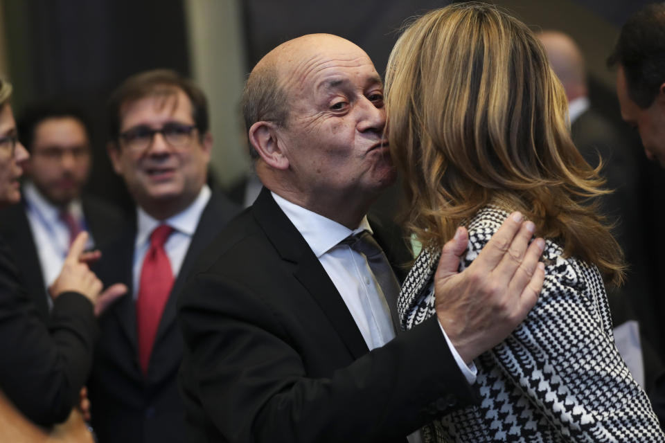 France's Foreign Minister Jean-Yves Le Drian, left, greets his Bulgaria's counterpart Ekaterina Zaharieva during a NATO Foreign Ministers meeting at the NATO headquarters in Brussels, Wednesday, Nov. 20, 2019. (AP Photo/Francisco Seco)