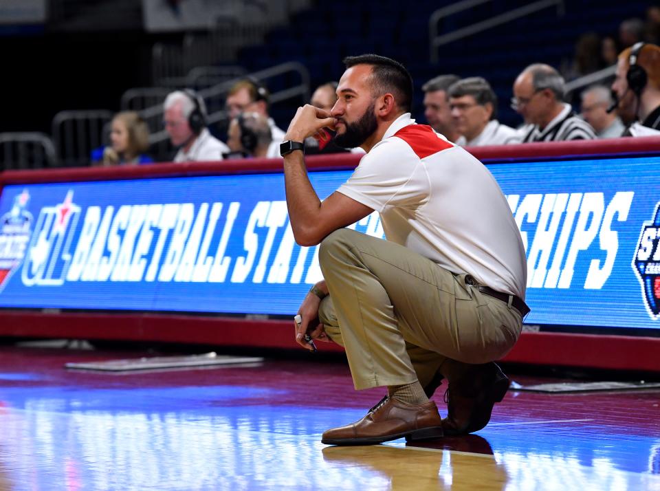 Hermleigh coach Duane Hopper watches his team during the Class 1A girls basketball semifinals at the Alamodome in San Antonio on Feb. 28, 2019.