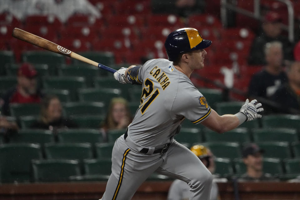 Milwaukee Brewers' Mark Canha follows through on a three-run double during the ninth inning of a baseball game against the St. Louis Cardinals Wednesday, Sept. 20, 2023, in St. Louis. (AP Photo/Jeff Roberson)
