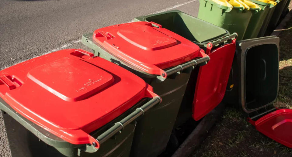 A photo of red and yellow bins.