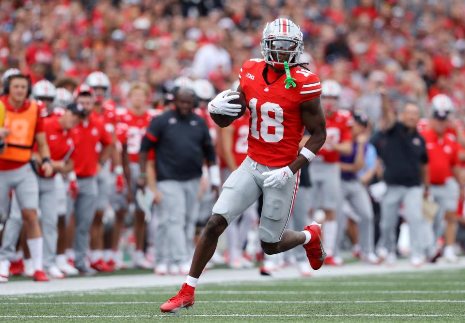 Ohio State Buckeyes wide receiver Marvin Harrison Jr. (18) runs after the catch during the first quarter against the Western Kentucky Hilltoppers at Ohio Stadium in Columbus on Sept. 16, 2023.
