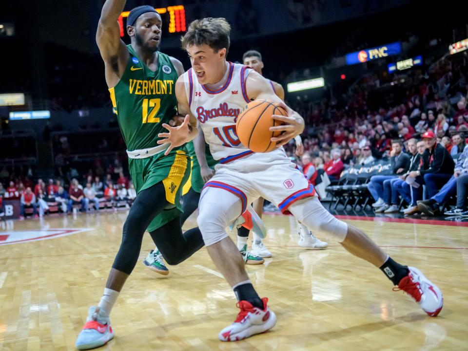 Bradley's Connor Hickman (10) moves against Vermont's Shamir Bogues in the first half of their nonconference basketball game Saturday, Nov. 25, 2023 at Carver Arena.