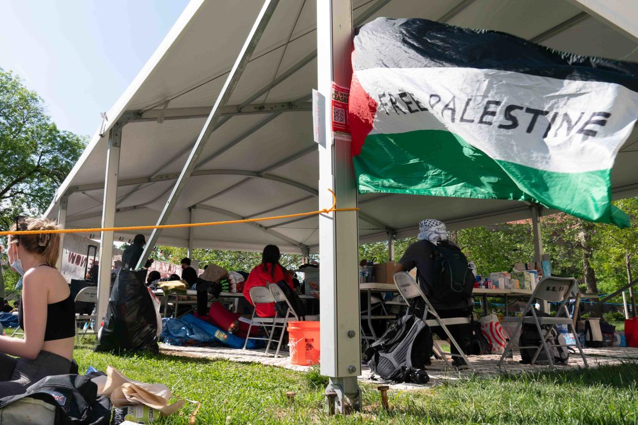 An Israeli flag with the words "Free Palestine" written on it waves in the wind Wednesday where students are protesting the ongoing Israel-Hamas war in Gaza at the University of Kansas.