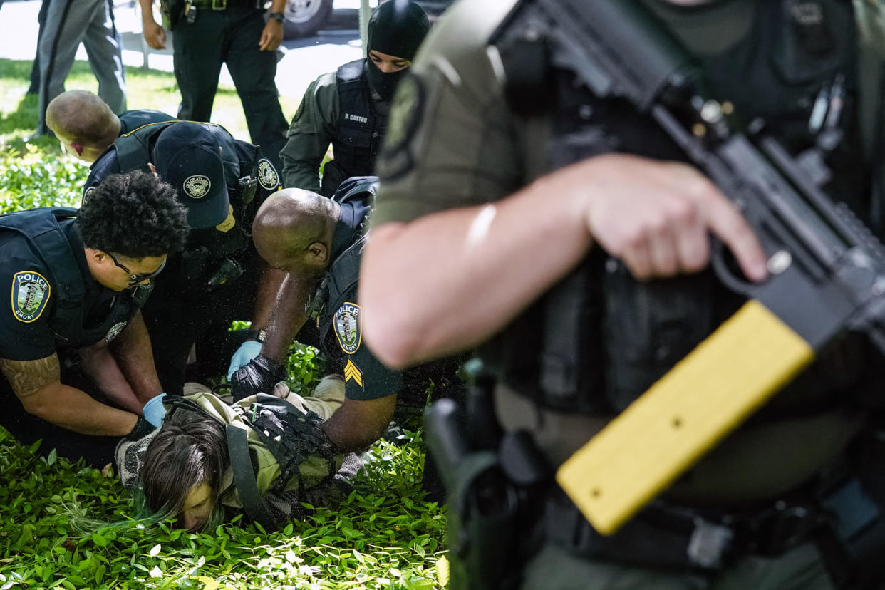Police officers detain a demonstrator during a pro-Palestinian protest at Emory University (Elijah Nouvelage / AFP-Getty Images)
