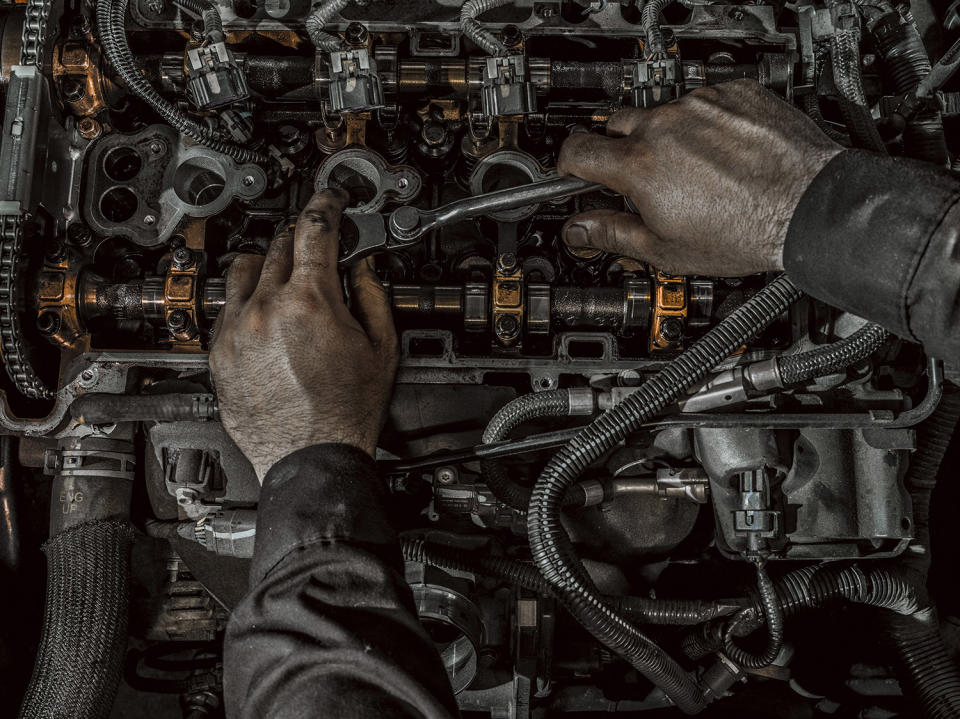 <p><strong>Stone —auto mechanic</strong><br> Sanwal Deen’s “Work” project offers a bird’s-eye view of the elaborate tasks carried out by people who work with their hands. (Photo: Sanwal Deen/Caters News) </p>