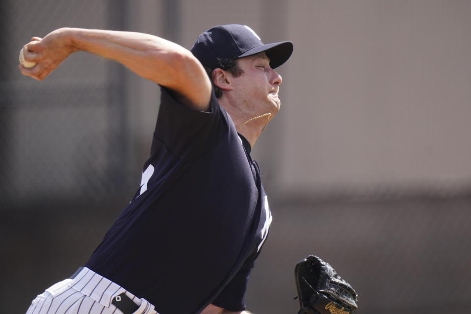 New York Yankees' Gerrit Cole delivers a pitch during a spring training baseball workout Monday, Feb. 22, 2021, in Tampa, Fla. (AP Photo/Frank Franklin II)
