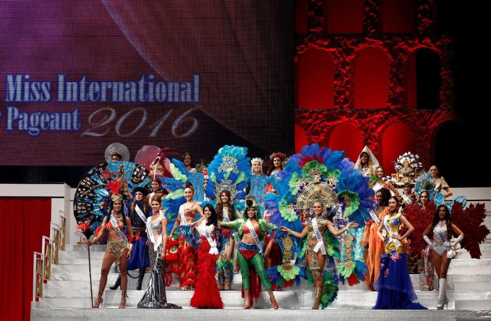 Contestants wearing national costumes pose in the opening of the 56th Miss International Beauty Pageant in Tokyo