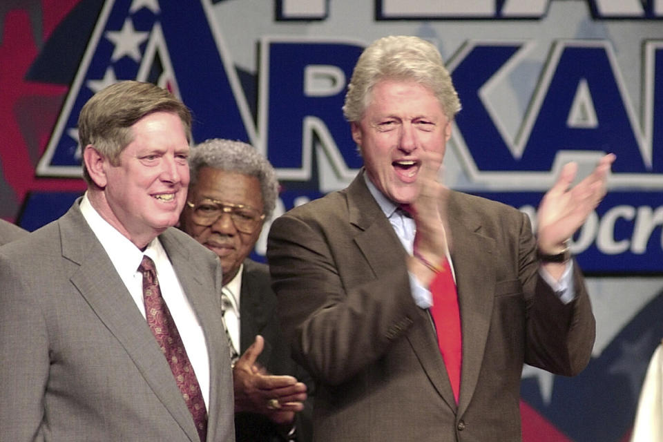 FILE - From left, U.S. Rep. Marion Berry, D-Ark., listens as former President Bill Clinton, center, applauds at a Democratic Party rally Monday, Aug. 26, 2002, in West Memphis, Ark. Berry, who was known for blunt rhetoric and his advocacy work for farmers and elderly residents in eastern Arkansas, has died. Berry's son, Mitch, in a statement Saturday, May 20, 2023 announced his father's death. (AP Photo/Danny Johnston, File)