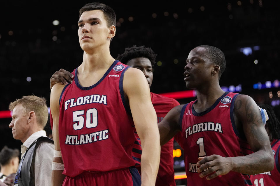 Florida Atlantic center Vladislav Goldin, left, reacts to their loss against San Diego State in a Final Four college basketball game in the NCAA Tournament on Saturday, April 1, 2023, in Houston. (AP Photo/David J. Phillip)