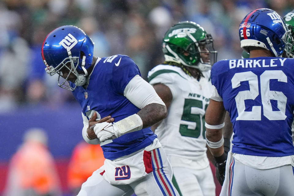 New York Giants quarterback Tyrod Taylor (2) runs back to his sideline after an apparent injury during the first half of an NFL football game against the New York Jets, Sunday, Oct. 29, 2023, in East Rutherford, N.J. (AP Photo/Frank Franklin II)