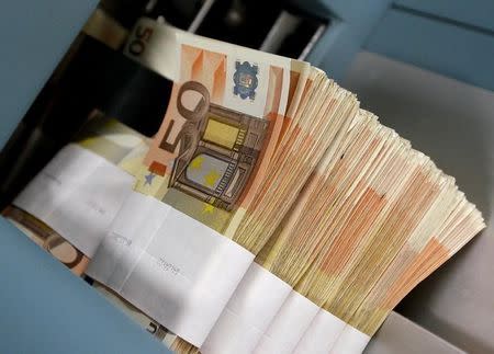 Fifty-euro notes are seen at the Belgian Central Bank in Brussels in this December 8, 2011 file photo. REUTERS/Yves Herman