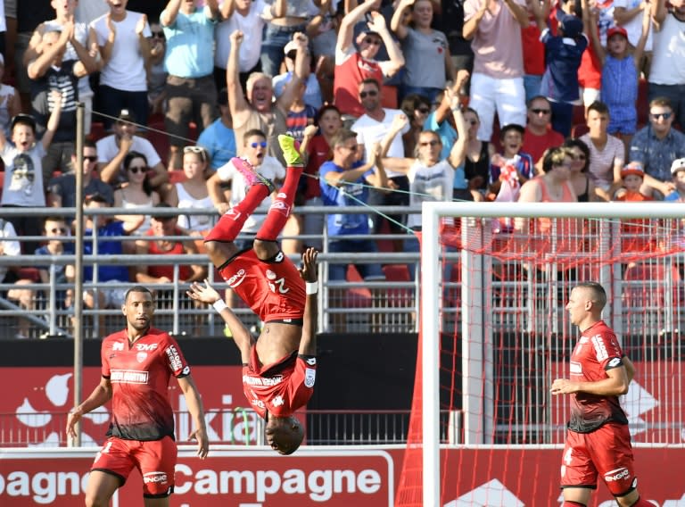 Dijon's French forward Dylan Bahamboula (C) celebrates after scoring during his team's French L1 football match against Olympique Lyonnais on August 27, 2016, at the Gaston Gérard stadium in Dijon, eastern France