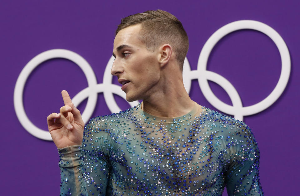 FILE - Adam Rippon of the United States reacts as his score is posted following his performance in the men's free figure skating final in the Gangneung Ice Arena at the 2018 Winter Olympics in Gangneung, South Korea, Saturday, Feb. 17, 2018. Rippon, who came out publicly in October 2015, was the first openly gay athlete to represent the United States in Olympic competition. (AP Photo/Bernat Armangue, File)