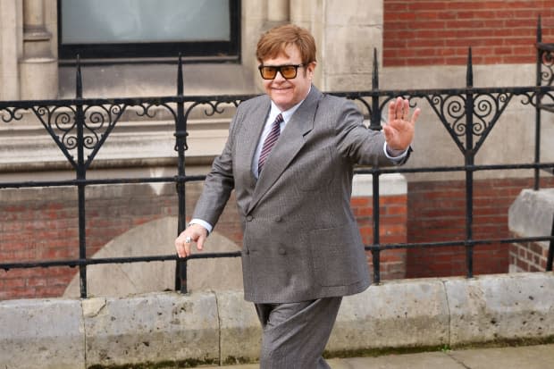 Elton John waves outside the Royal Courts of Justice on March 27, 2023, in London. Elton John is one of several claimants along with Prince Harry in a lawsuit against Associated Newspapers, publisher of the Daily Mail.<p><a href="https://www.gettyimages.com/detail/1249608938" rel="nofollow noopener" target="_blank" data-ylk="slk:Belinda Jiao/Getty Images;elm:context_link;itc:0;sec:content-canvas" class="link ">Belinda Jiao/Getty Images</a></p>