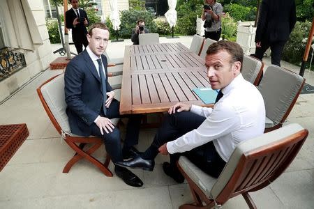 FILE PHOTO: Facebook's founder and CEO Mark Zuckerberg meets with French President Emmanuel Macron at the Elysee Palace after the "Tech for Good" summit, in Paris, France, May 23, 2018. Christophe Petit Tesson/Pool via Reuters/File Photo