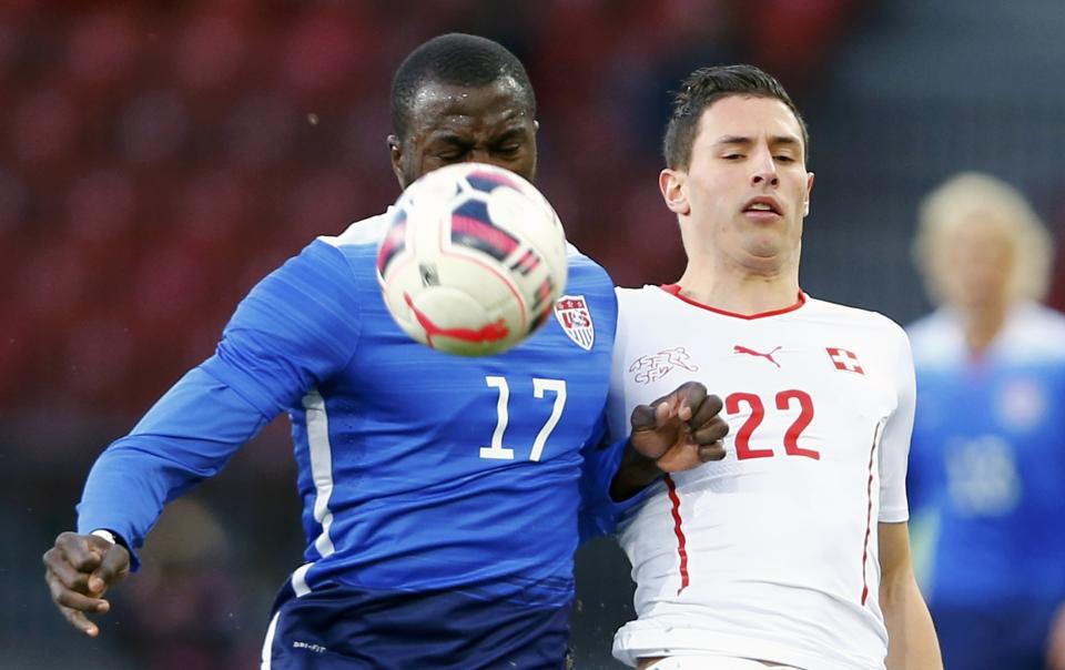 Schar of Switzerland challenges Altidore of the U.S during their international friendly soccer match at the Letzigrund Stadium in Zurich