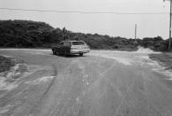 A car follows the curve of Chappaquiddick Road to the left on Chappaquiddick Island near Edgartown, Mass., on Aug. 9, 1969. Cemetery Road is straight ahead. On the night of his car accident with Mary Jo Kopechne, Ted Kennedy turned right onto Dike Road and drove off the bridge farther down. (Photo: Bettmann/Getty Images)