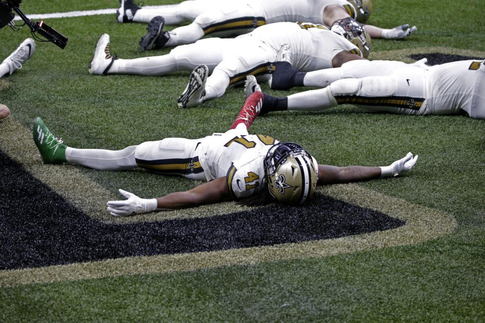 New Orleans Saints running back Alvin Kamara (41) celebrates his sixth touchdown of the game, tying the NFL record for most rushing touchdowns in a game, in the second half of an NFL football game against the Minnesota Vikings in New Orleans, Friday, Dec. 25, 2020. (AP Photo/Butch Dill)