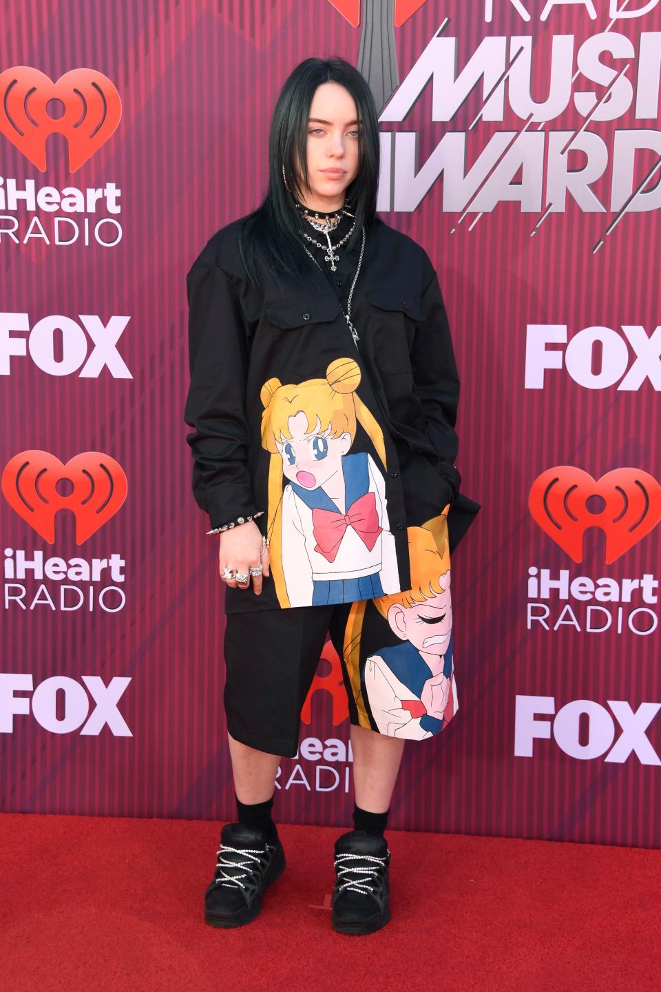 Billie Eilish walks the red carpet in a Sailor Moon-inspired outfit at the iHeartRadio Music Awards in Los Angeles this month.