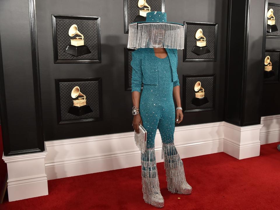 Billy Porter at the 2020 Grammy Awards in blue outfit with large headpiece