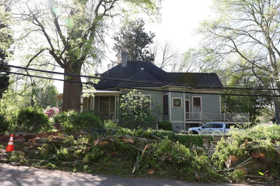 Severe storms last night caused several trees to fall around homes, like this one at the corner of Franklin Ave. and Spring St. NW in Concord, on Friday, April 12, 2024.