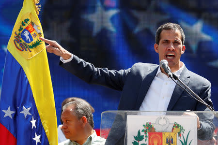 Venezuelan opposition leader and self-proclaimed interim president Juan Guaido gestures during a rally against Venezuelan President Nicolas Maduro's government in Caracas, Venezuela February 2, 2019. REUTERS/Carlos Garcia Rawlins