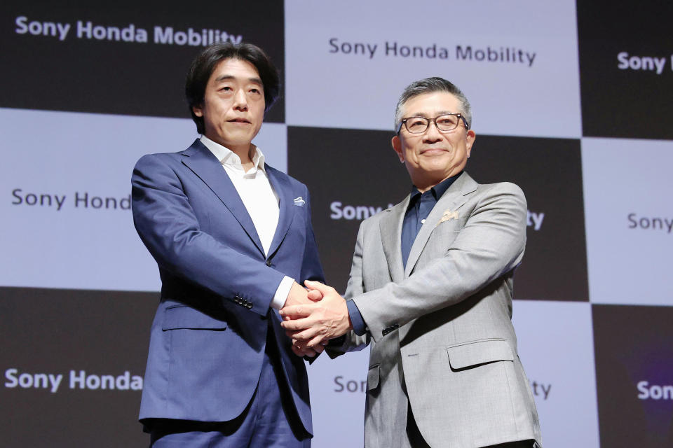 Izumi Kawanishi, left, the Sony executive who became Chief Operating Officer at Sony Mobility and Chief Executive Yasuhide Mizuno pose for a photo during a news conference in Tokyo Thursday, Oct. 13, 2022. A new electric car company that brings together two big names in Japanese business, Honda and Sony, officially kicked off Thursday, with both sides stressing their common values of taking up challenges and serving people’s needs. (Takuto Kaneko/Kyodo News via AP)